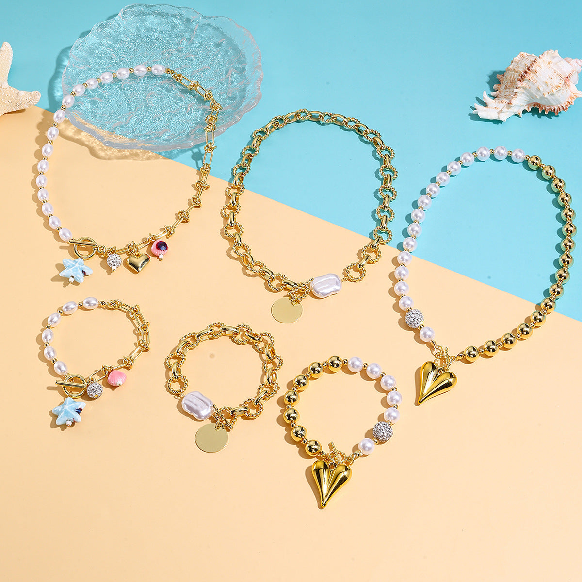 Wholesale  best-selling trendy pearl heart necklace and bracelet set for women  featuring a luxurious and sophisticated ocean-themed design