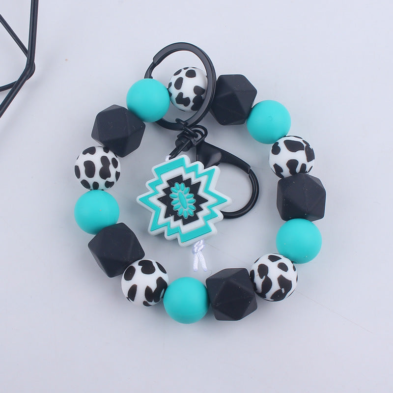 Wholesale Cartoon Bull Head Aztec Cross Silicone Beaded Wrist Keychain