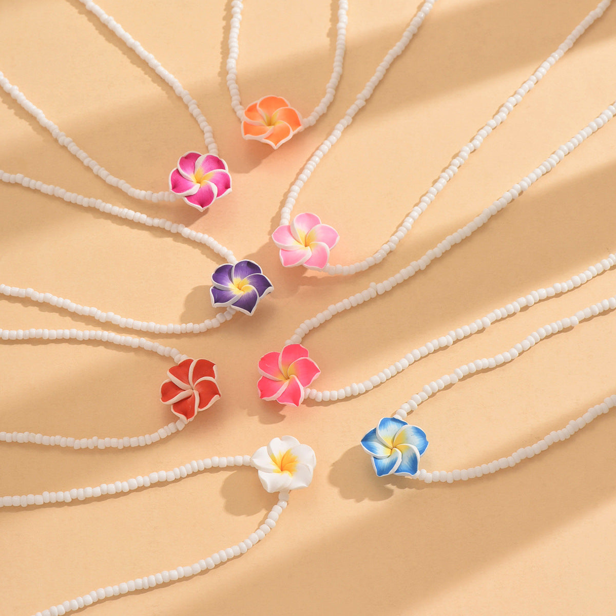 Wholesale Bohemian holiday style cute frangipani soft clay flower rice bead necklace