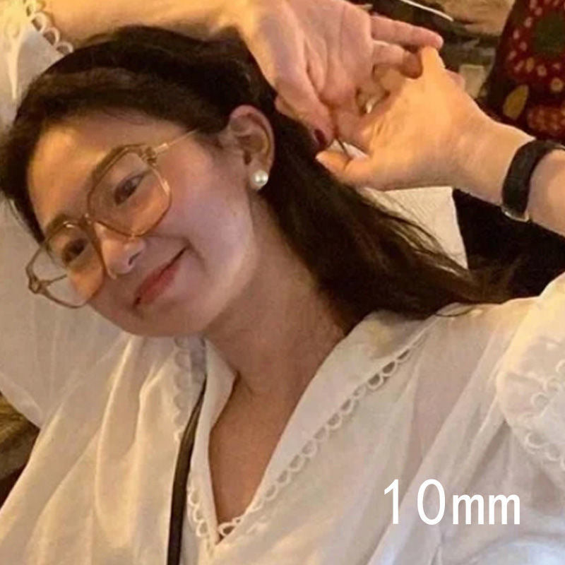 Wholesale big round pearl hollow mosquito coil ear clip earrings