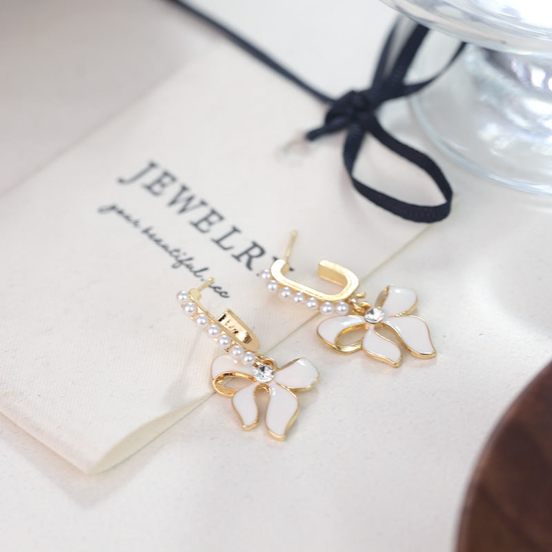 Wholesale White Bow Inlaid Pearl S925 Silver Needle Alloy Earrings ACC-ES-RuLong009