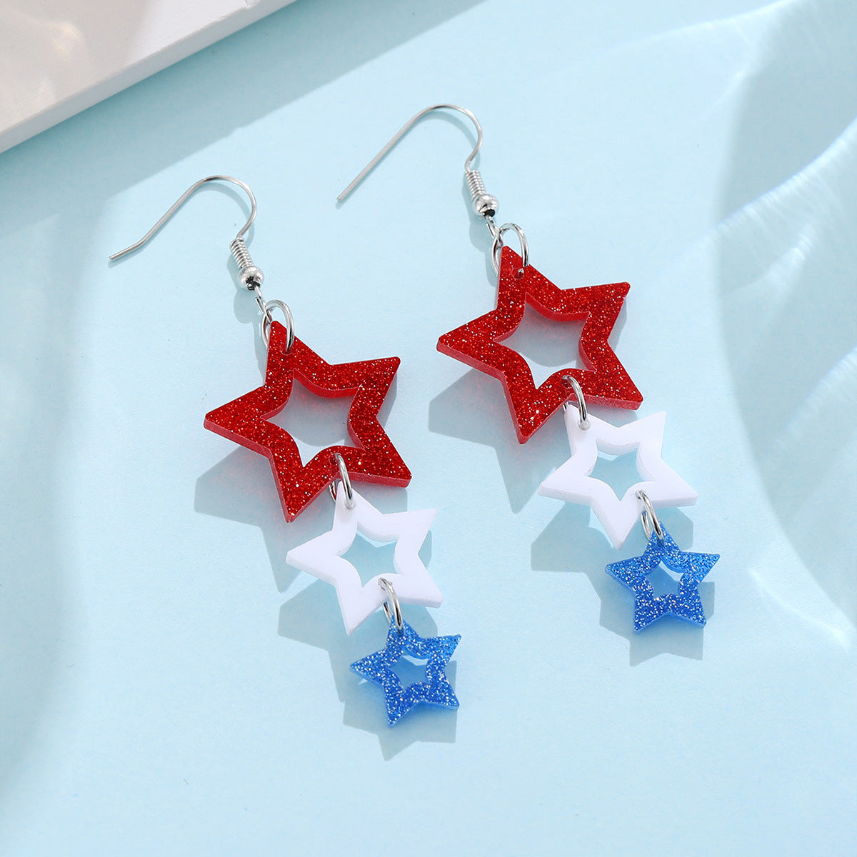 Wholesale Red, white and blue star hollow stitching earrings