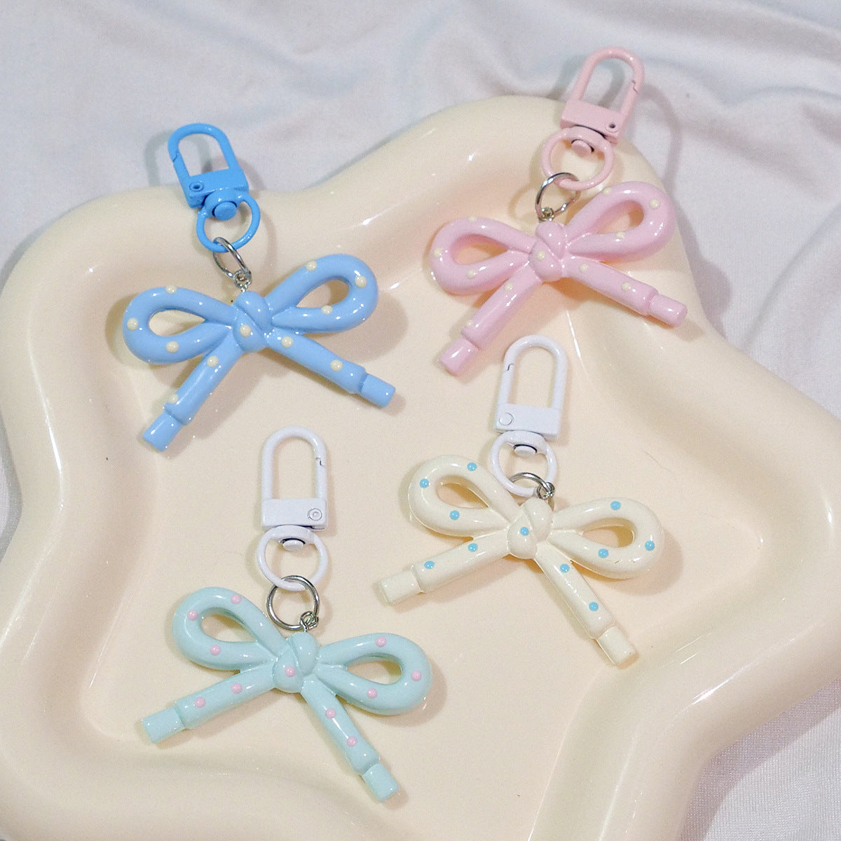 Wholesale Hollow Candy Colored Resin Bow Keychain Pendant,  Modern Bag Charm for Backpack