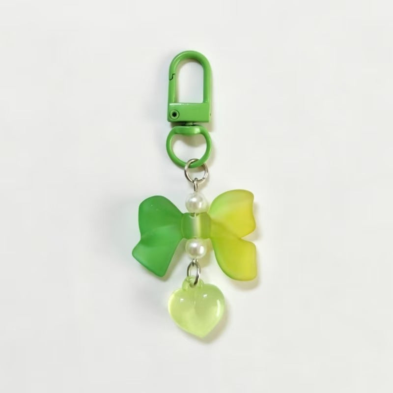 Wholesale Bow Pearl Heart Pendant in Candy Color