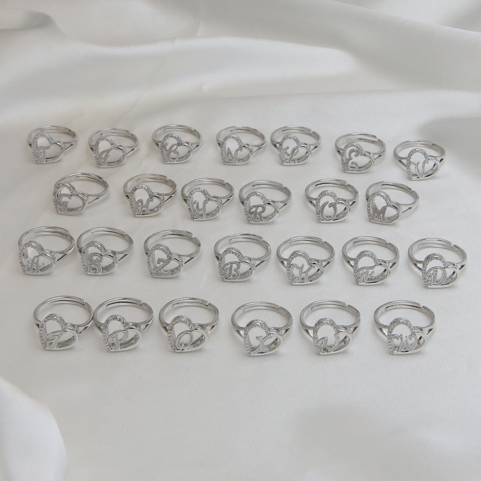 Wholesale  heart-shaped love texture hollow 26 grass English letters open heart ring