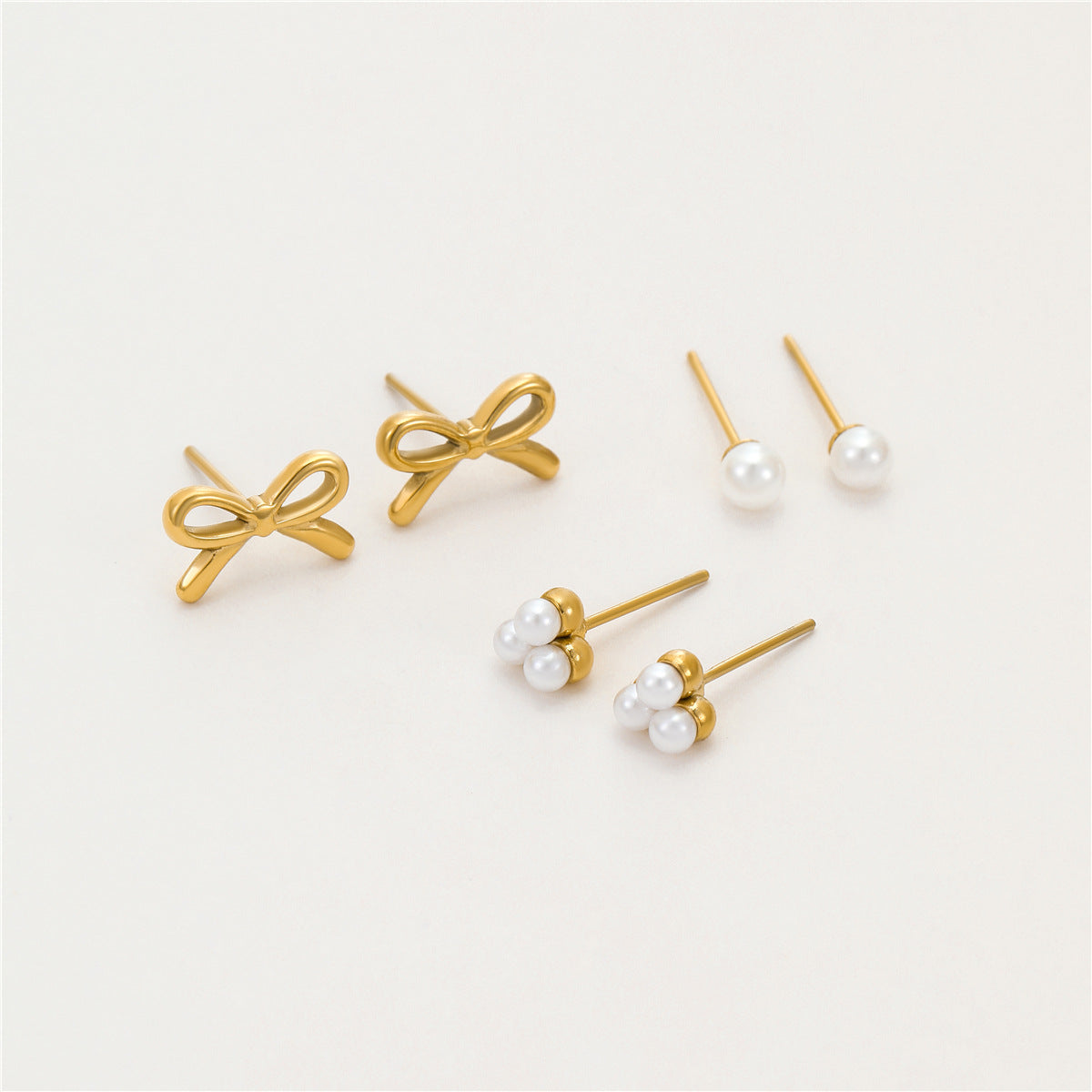 Wholesale light luxury  bow pearl stainless steel earrings