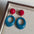 Wholesale exaggerated blue and red ear clips