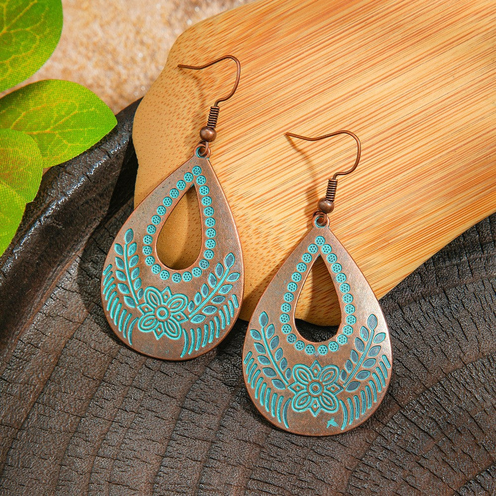 Wholesale Retro Bohemian Turquoise Heart Hollow Leaves Alloy Earrings for Party Wear Boutique Resale Jewelry