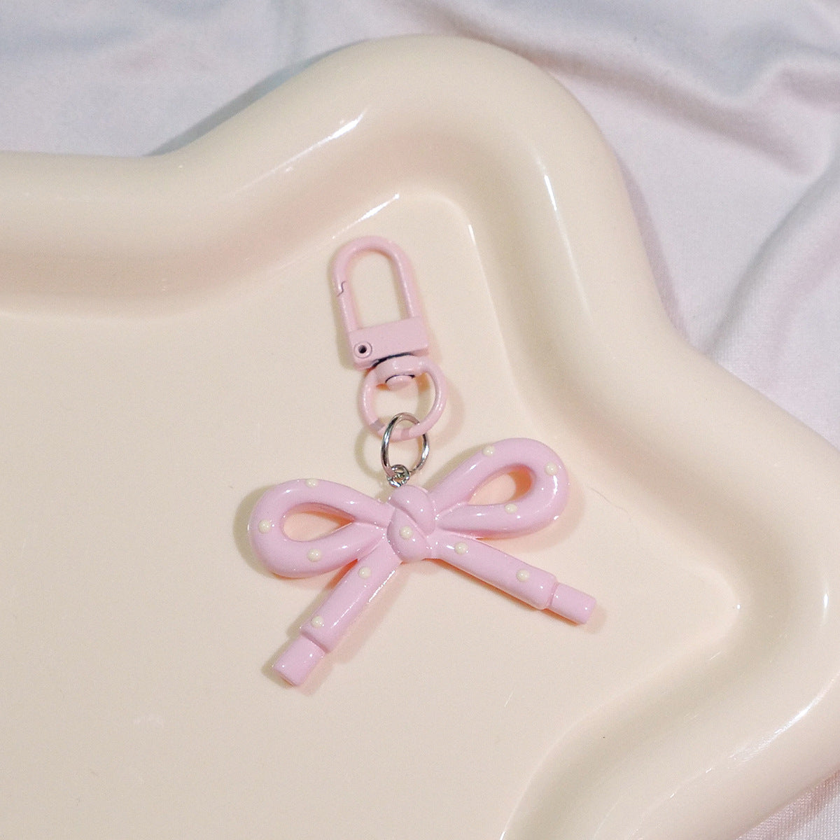 Wholesale Hollow Candy Colored Resin Bow Keychain Pendant,  Modern Bag Charm for Backpack