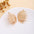 Wholesale Retro Flower Pearl Hollow Love Light Luxury Earrings
