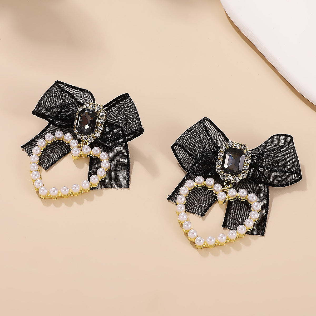 Wholesale Heart-shaped bow man-made pearl earrings