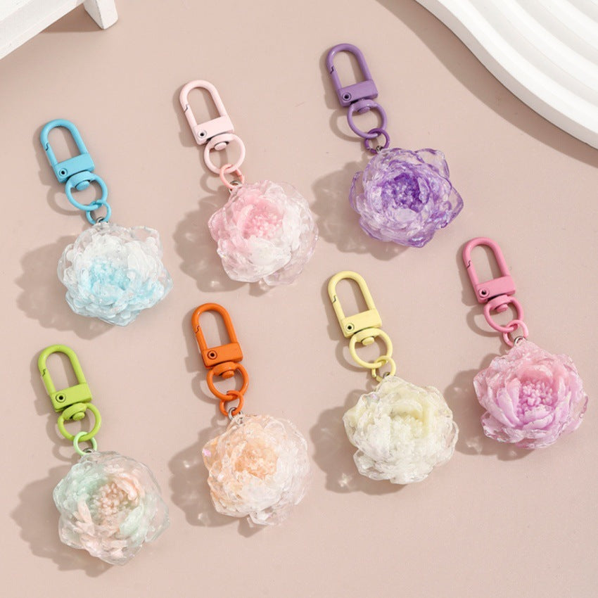 Wholesale colorful glittery camellia keychain