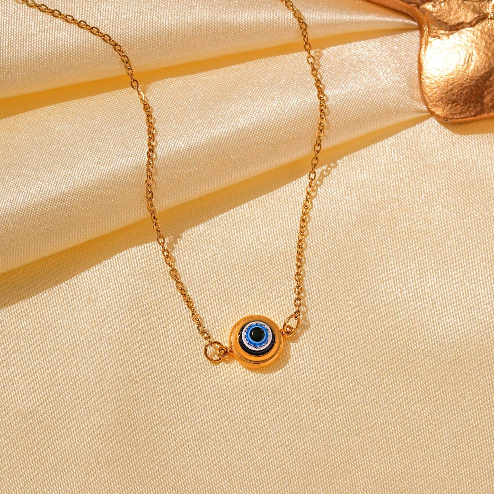 Wholesale Titanium Steel Retro Hip-hop Blue Devil's Eye Bow Love Pendant Evil Eye Necklace