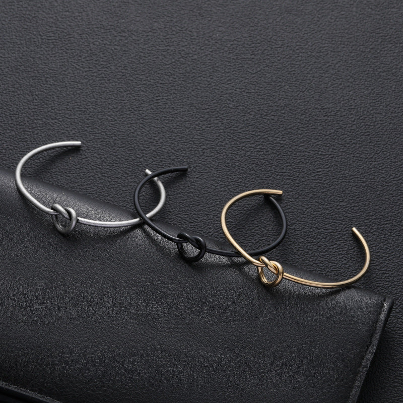 Bracciale semplice a forma di C annodato con amore in acciaio inossidabile all'ingrosso