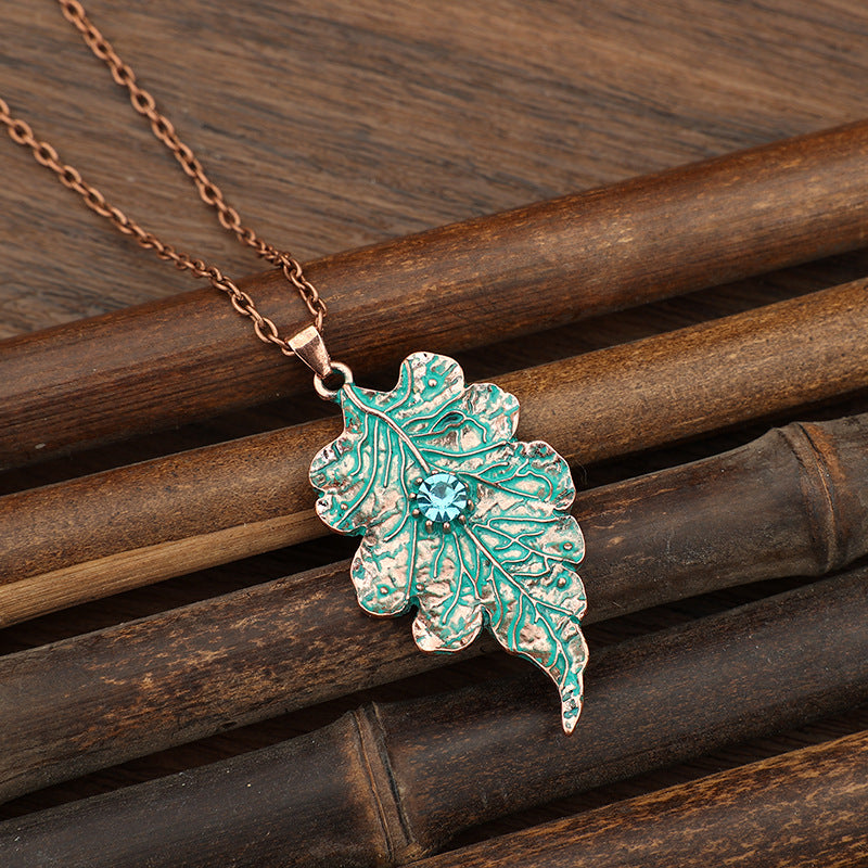 Wholesale Vintage-Style Distressed Leaf Vein Pendant Necklace — Antique Bronze &  Lake Green Enamel Leaf with Blue Crystal Accent — Forest-Themed Alloy Jewelry