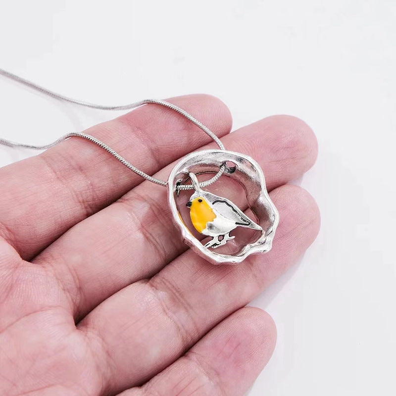 Wholesale Oval Hollow Oil Dropping Bird Necklace Creative Small Animal Pendant