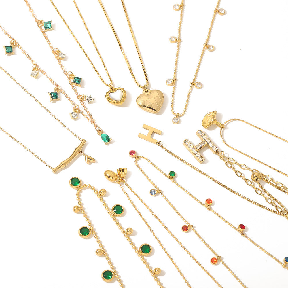 Wholesale stainless steel bamboo love fishtail skirt letter zircon necklace