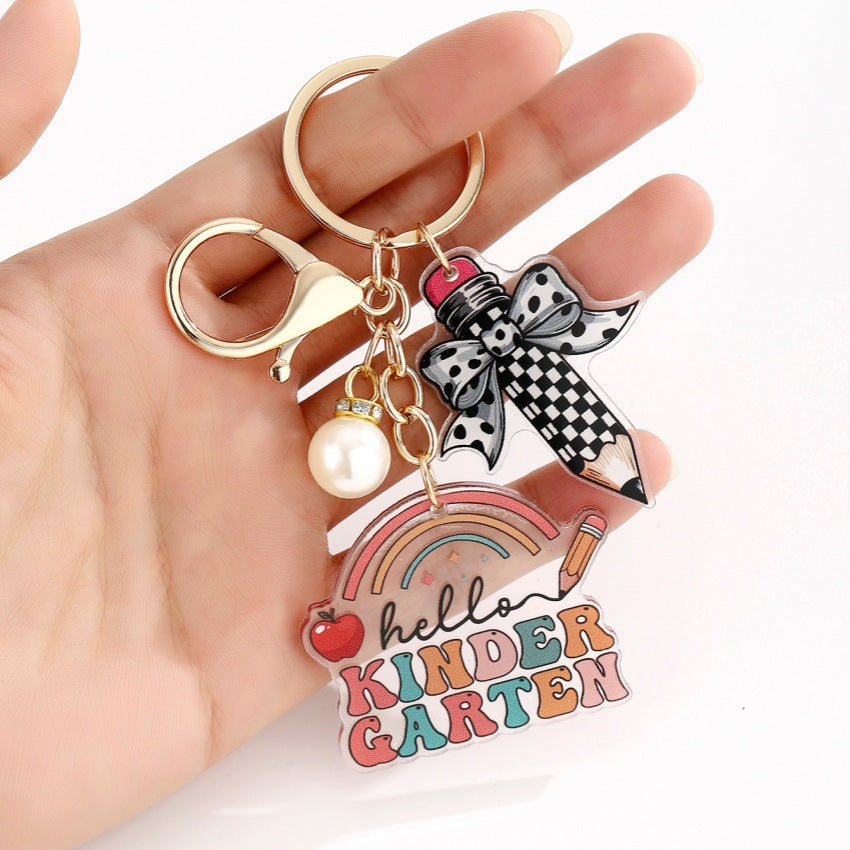 Portachiavi a matita con slogan e lettera di perle di libro acrilico all'ingrosso