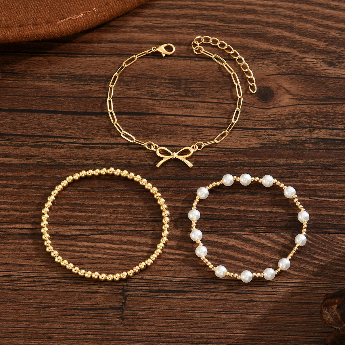 Wholesale Alloy pearl chain and bowknot layered bracelet set for women