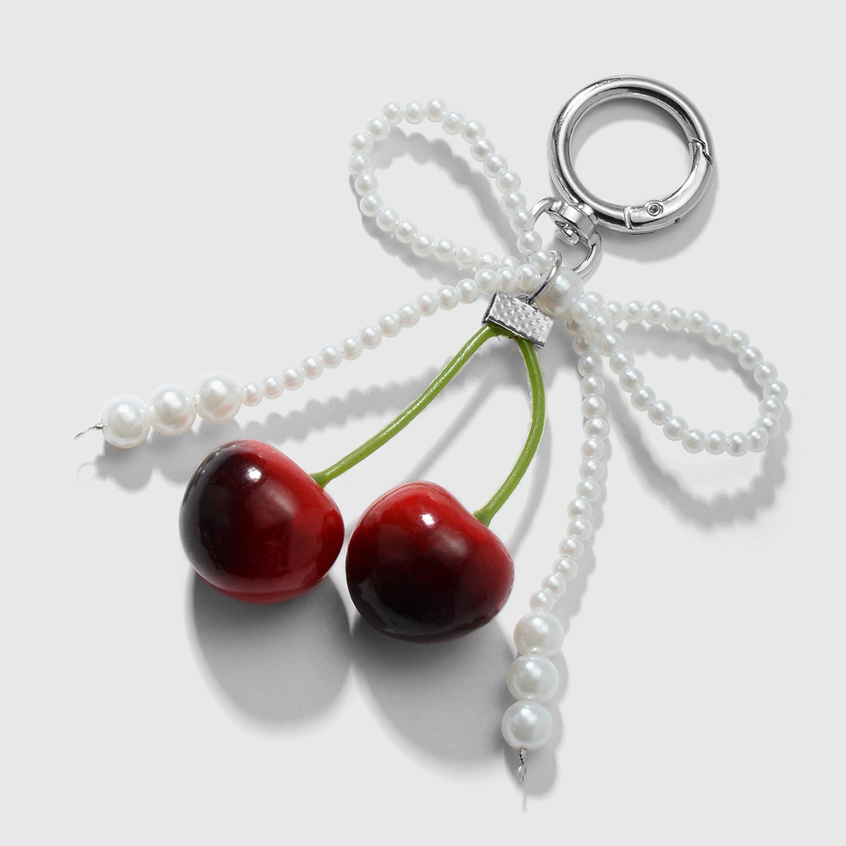 Wholesale Zinc alloy artificial pearl lace leopard print bowknot cherry keychain