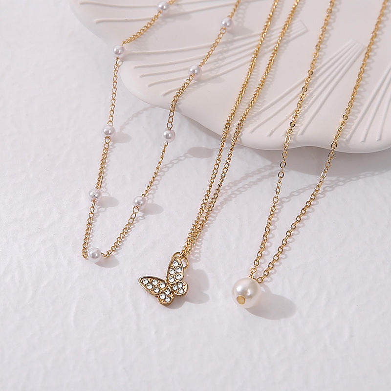 Wholesale Multi-layered pearl and diamond butterfly necklace