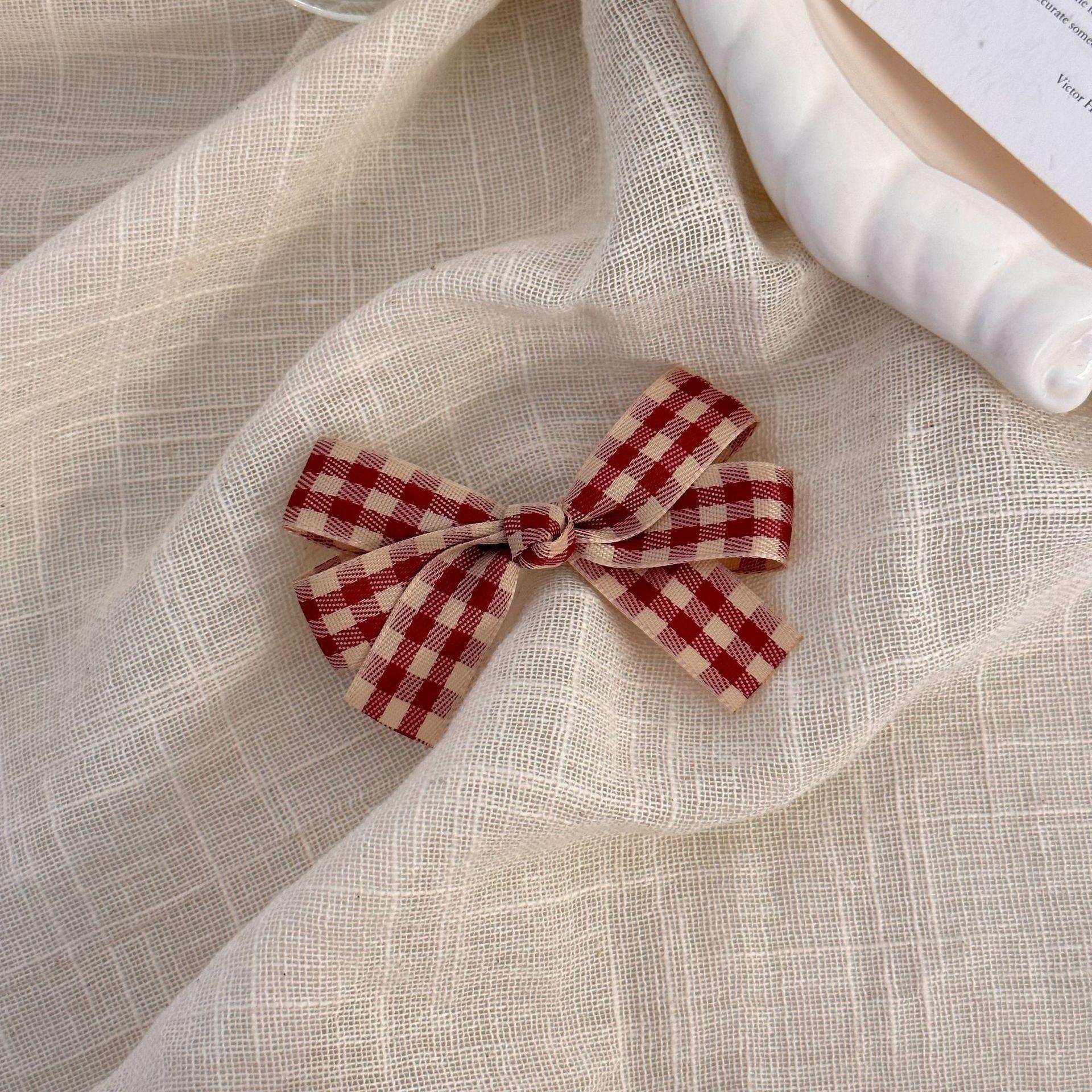 Großhandel rote Plaid Bogen Haarnadel süße Entenbill Clip