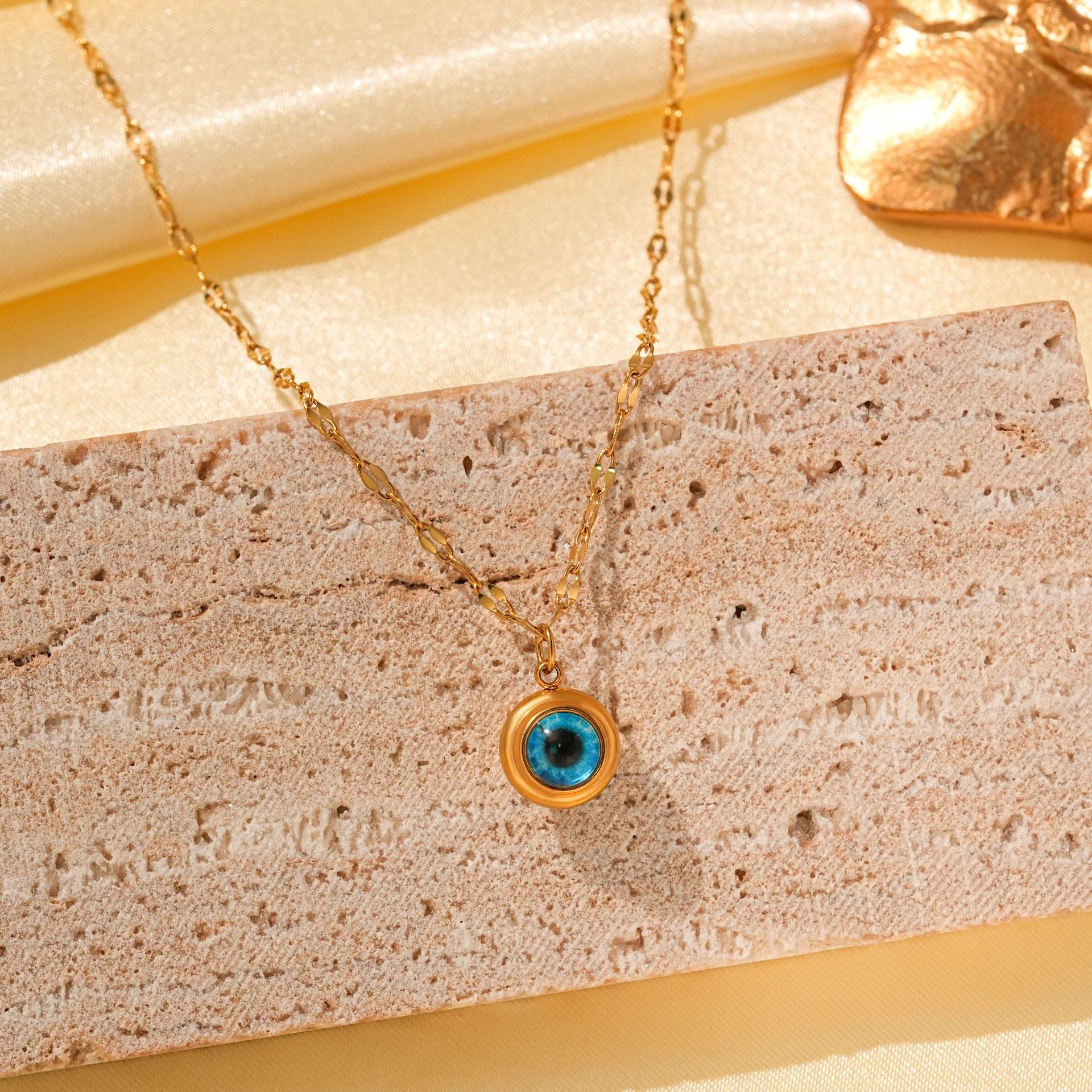 Wholesale Titanium Steel Retro Hip-hop Blue Devil's Eye Bow Love Pendant Evil Eye Necklace