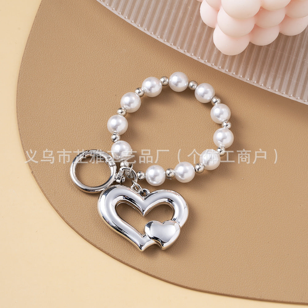 Wholesale Light Luxury Resin Alloy Peach Heart Pearl Keychains