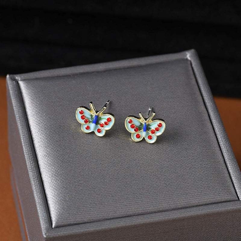 Wholesale drip glaze blue small butterfly diamond earrings