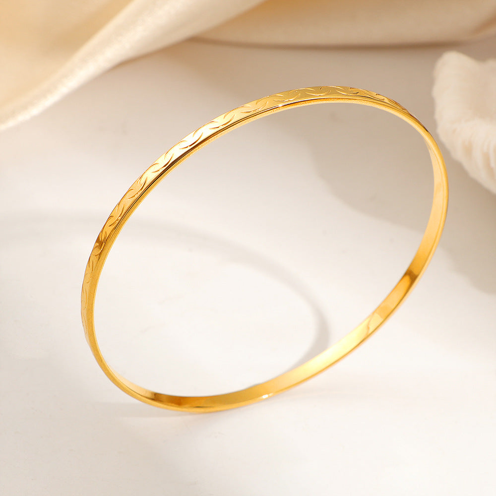 Wholesale Stylish Titanium Steel Slim Bangle with Patterned Smiley Face Design
