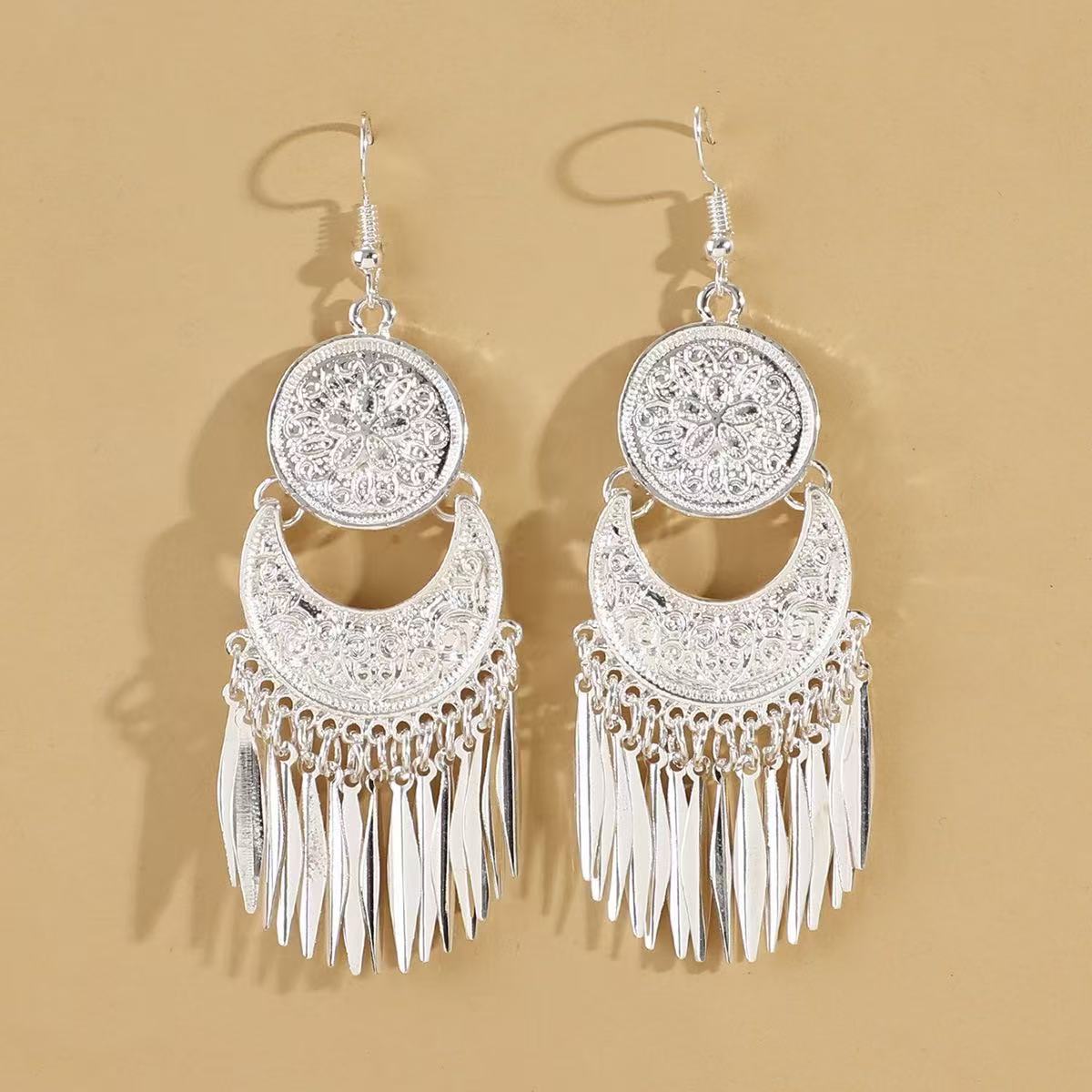 Wholesale Bohemian hollow  carved long tassel earrings