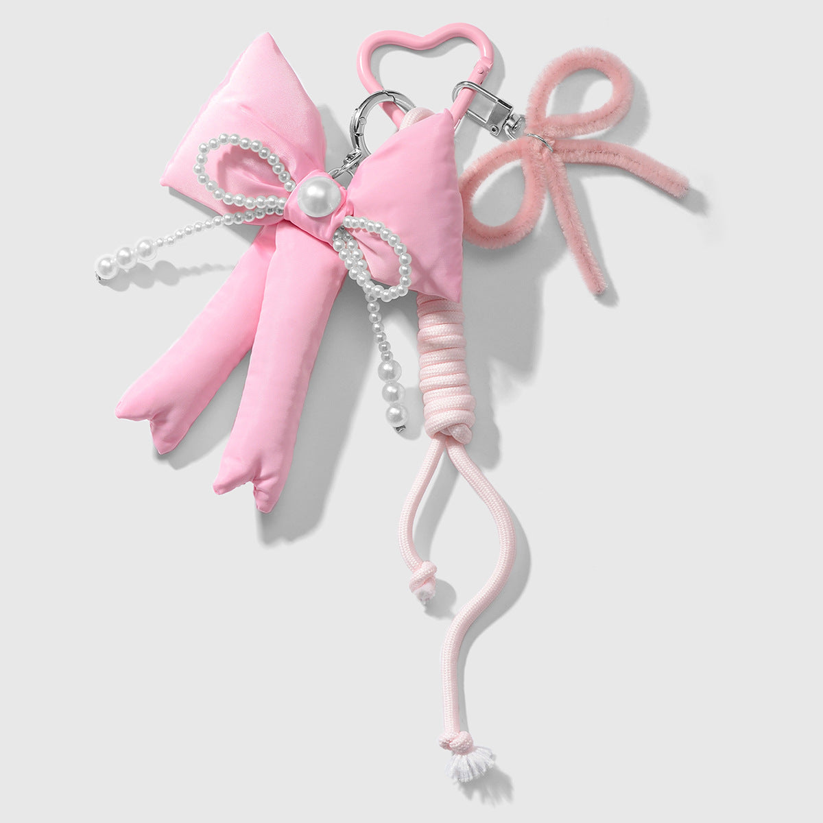 Wholesale Zinc alloy pink twistable stick bowknot and heart-shaped keychain