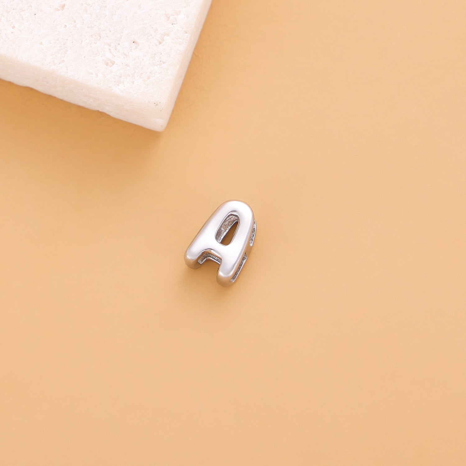 Wholesale Hollow small letters stainless steel plated 18K gold mini pendant