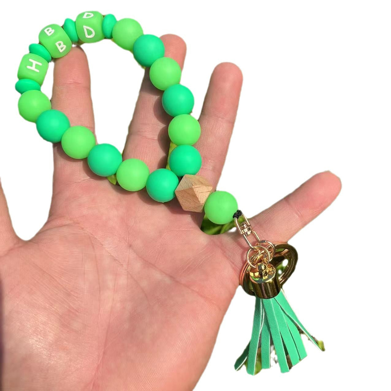 Wholesale Silicone Glow In The Dark Bead Bracelet Keychain With PU Tassels Trendy Car Key Bag Charm Accessory