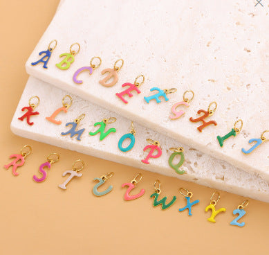 Wholesale Colorful 26 English letter pendant oil drop titanium steel vacuum plating pendant