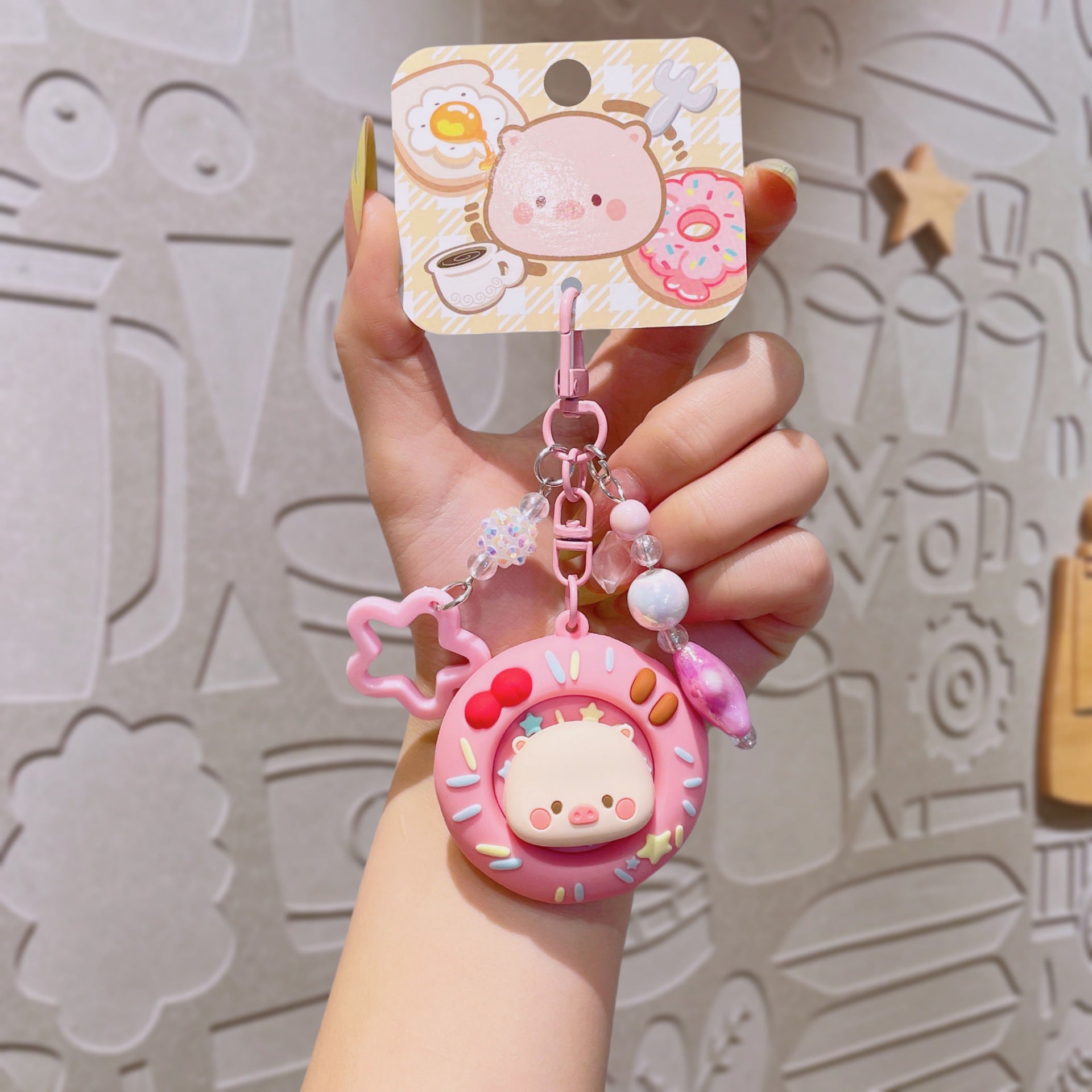 Wholesale Cute cartoon PVC pig spinning donut keychain