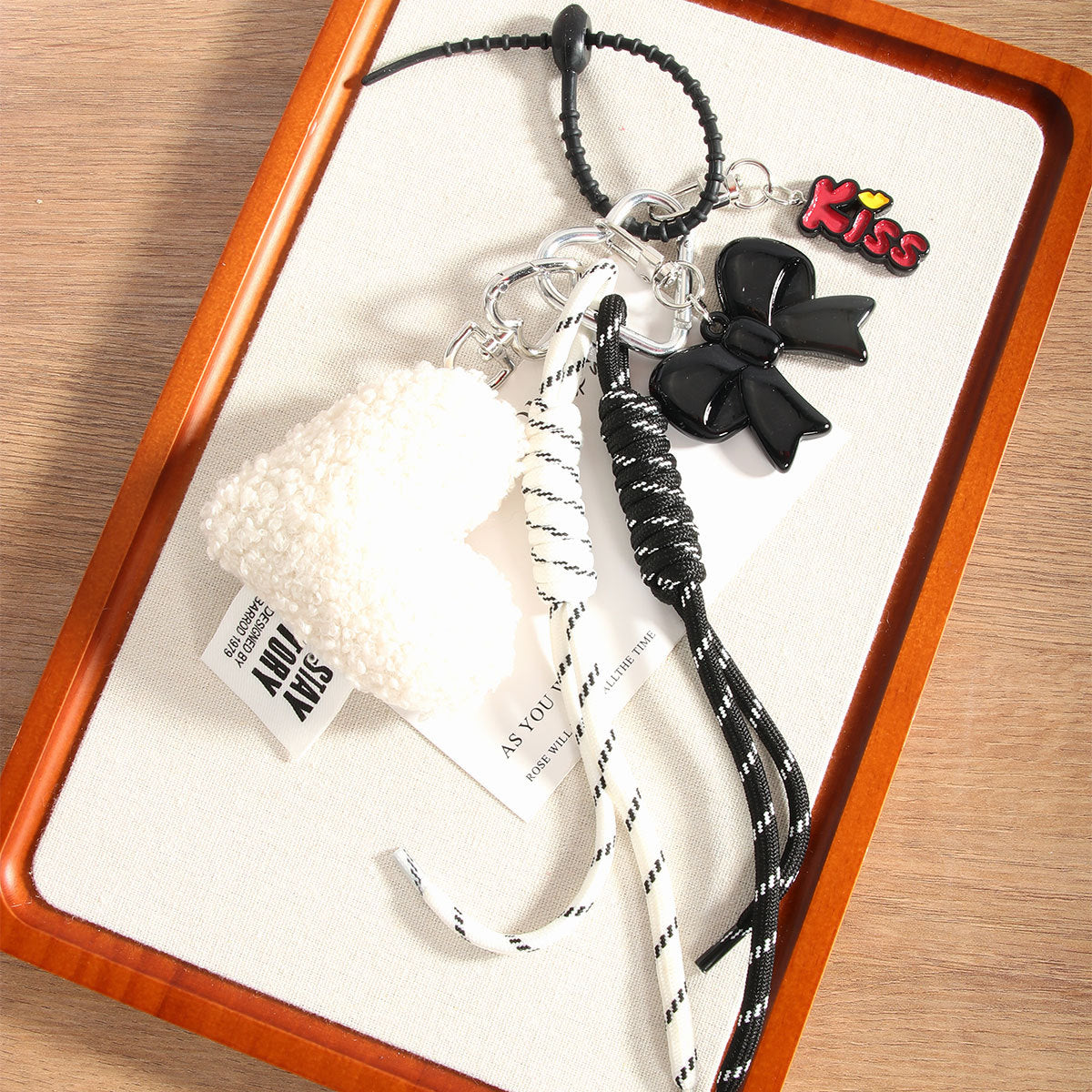 Wholesale Heart-shaped bowknot bag keychain made with woven cord