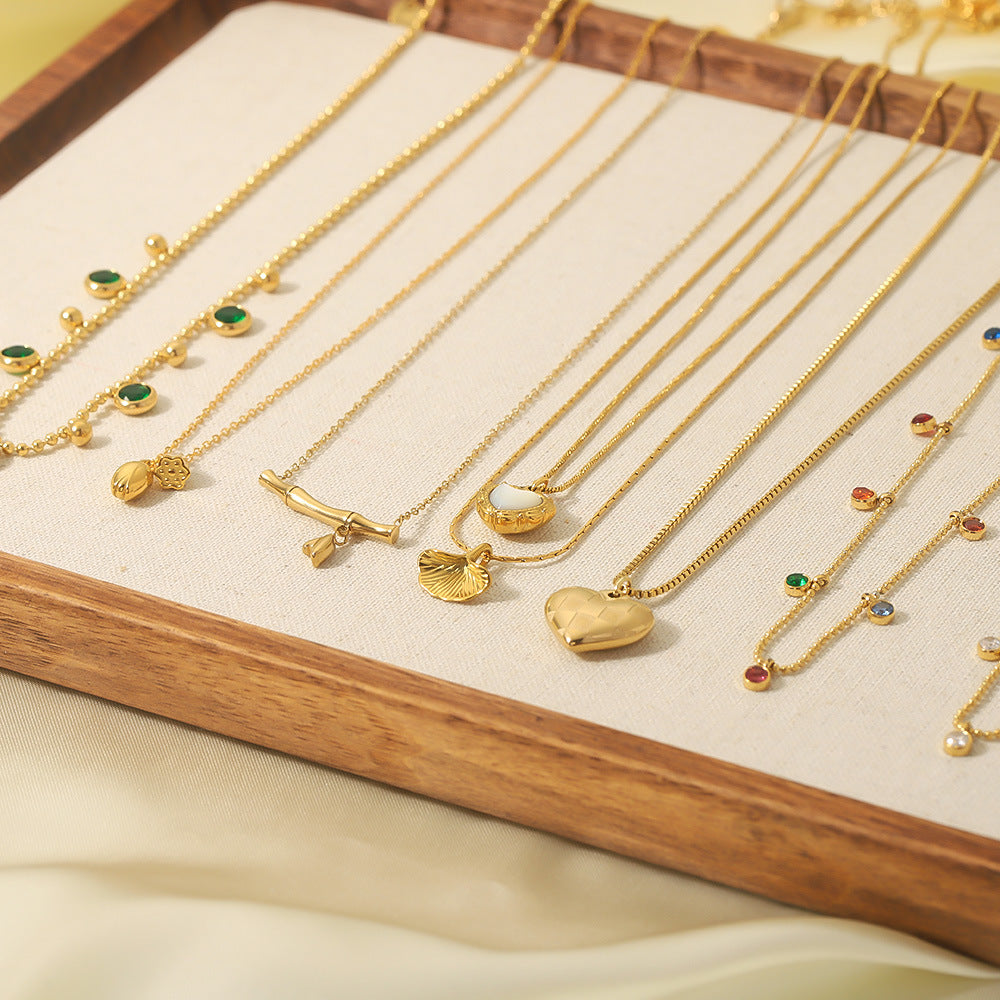 Wholesale stainless steel bamboo love fishtail skirt letter zircon necklace