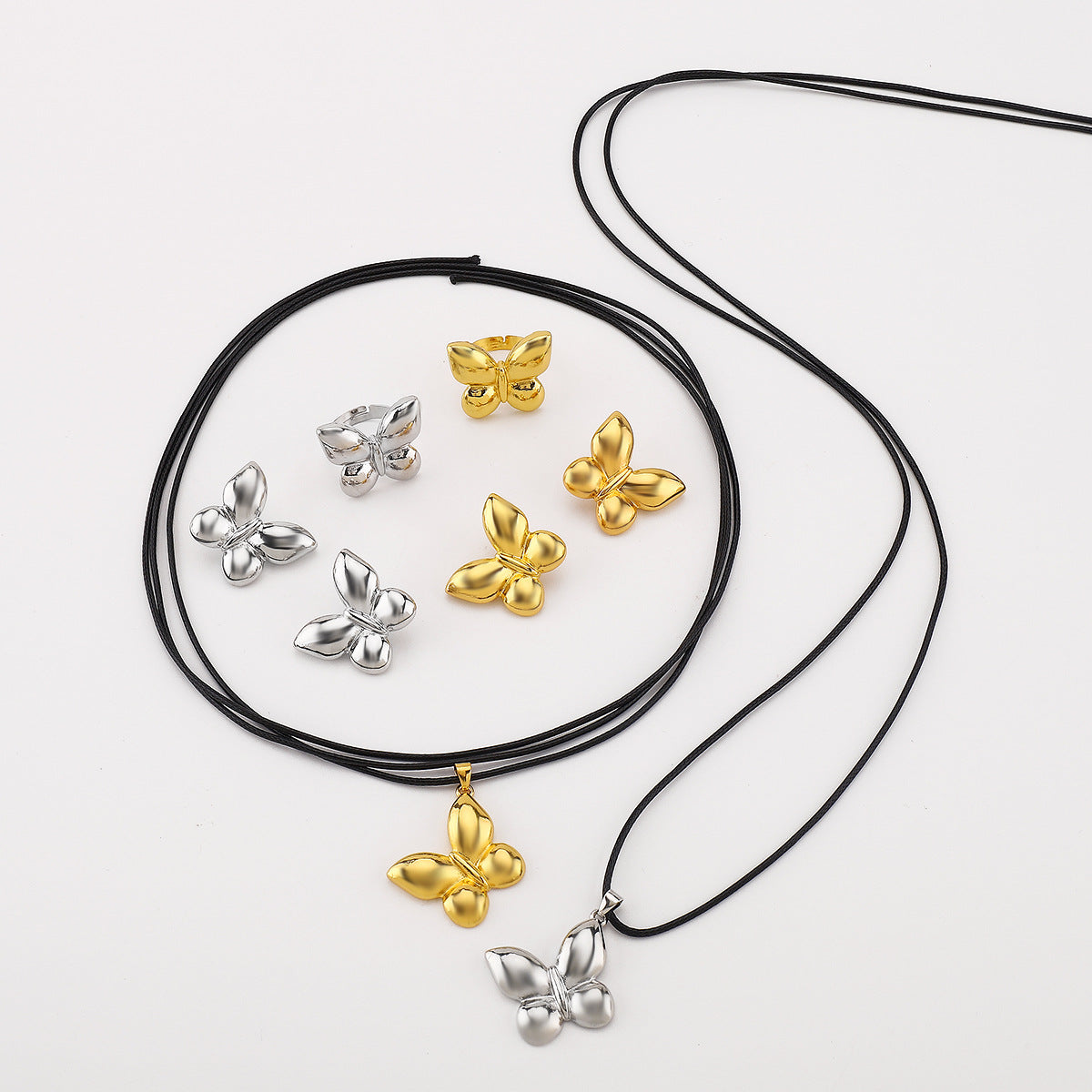 Orecchini a farfalla all'ingrosso Stessa collana di cera Anello in lega tutto-fiammifero