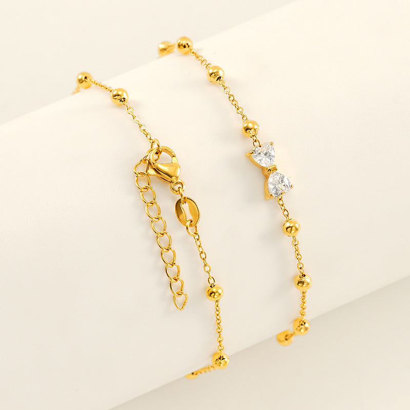Wholesale Stainless steel bracelet with zircon flowers and a bowknot design