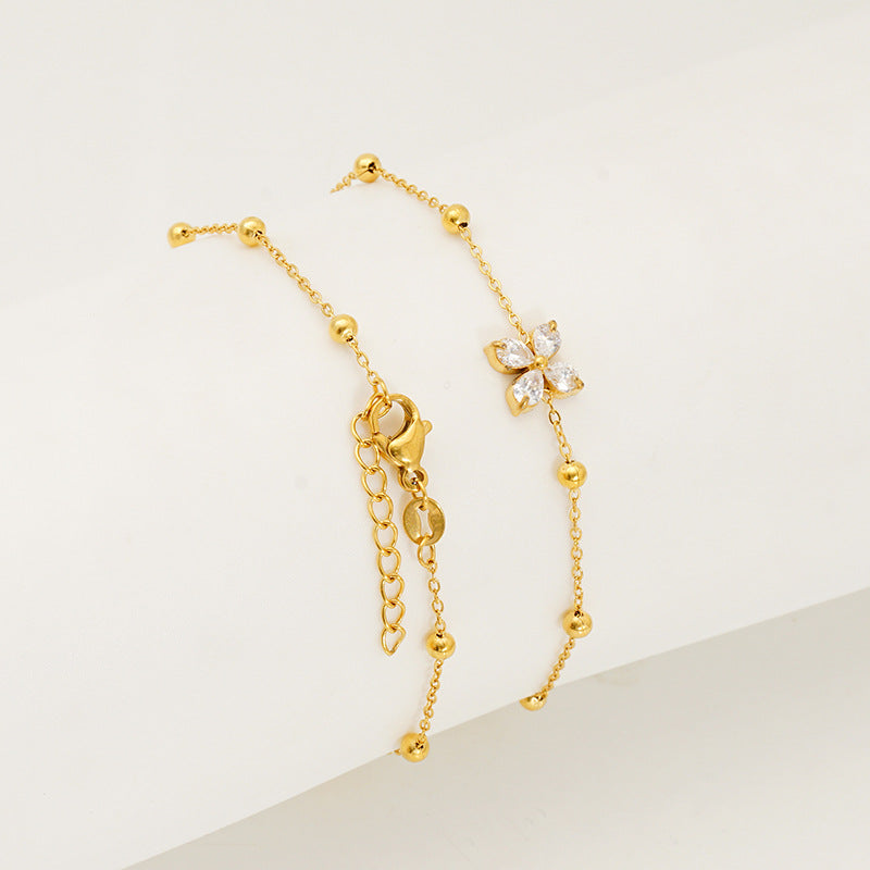Wholesale Stainless steel bracelet with zircon flowers and a bowknot design