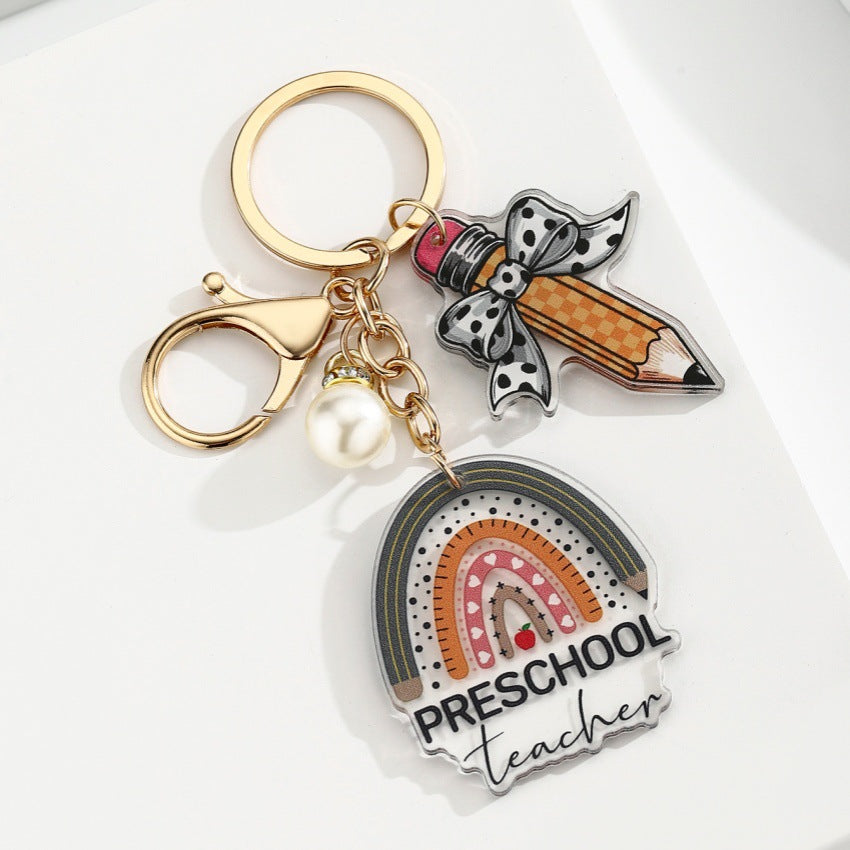 Portachiavi a matita con slogan e lettera di perle di libro acrilico all'ingrosso