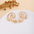 Wholesale Retro Flower Pearl Hollow Love Light Luxury Earrings