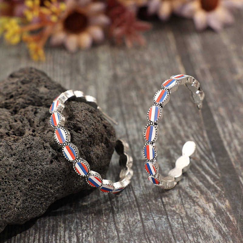 Wholesale American Independence Day C-shaped inlaid acrylic blue,white and red striped alloy earrings