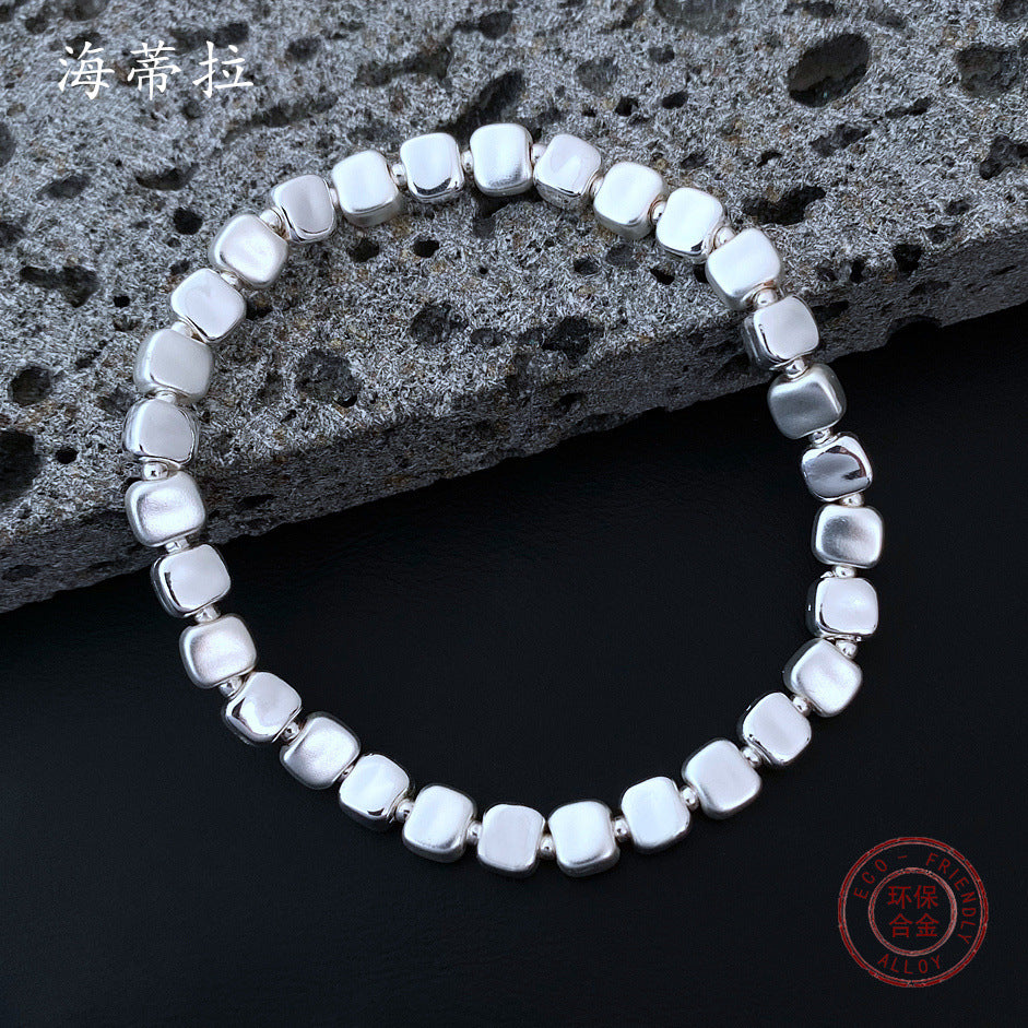 Wholesale small square grain three-color stitching alloy bracelet