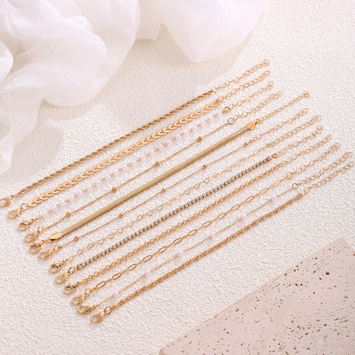 Wholesale Gold Tone 12 Piece Bracelet Set With Airplane Pearl Heart Designs Trendy Resale Jewelry Accessory