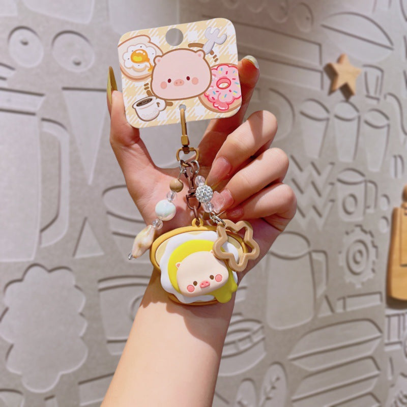 Wholesale Cute cartoon PVC pig spinning donut keychain