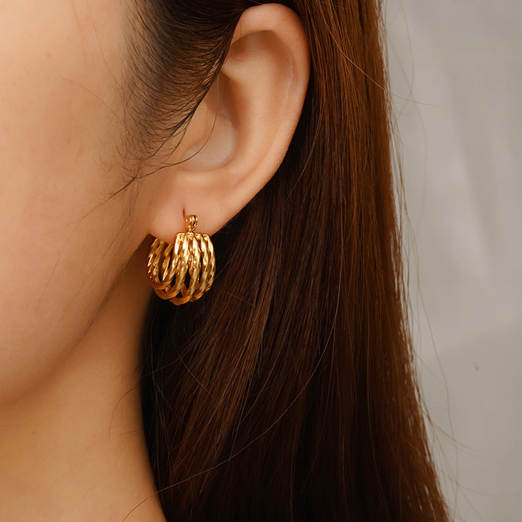 Wholesale temperament stitching twisted titanium steel earrings