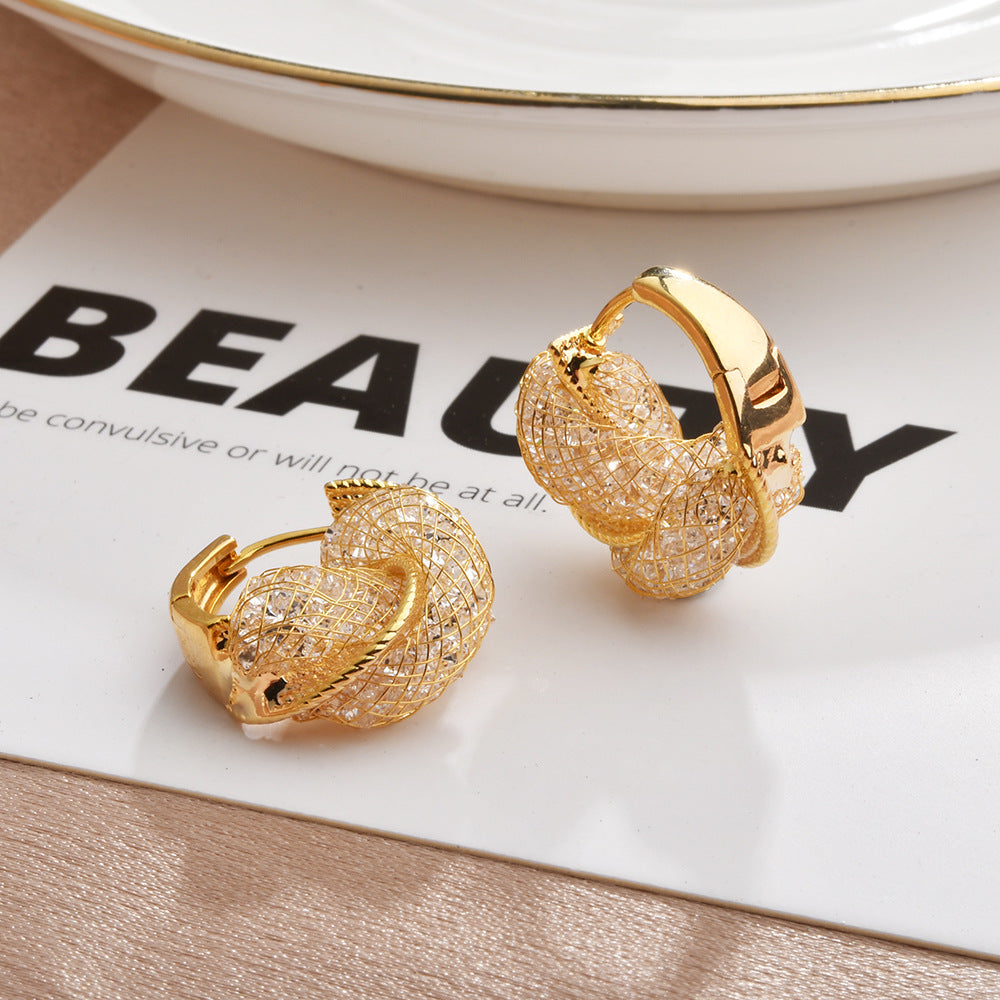 Wholesale Light luxury hollow twist earrings with glittering crystal wrap earrings