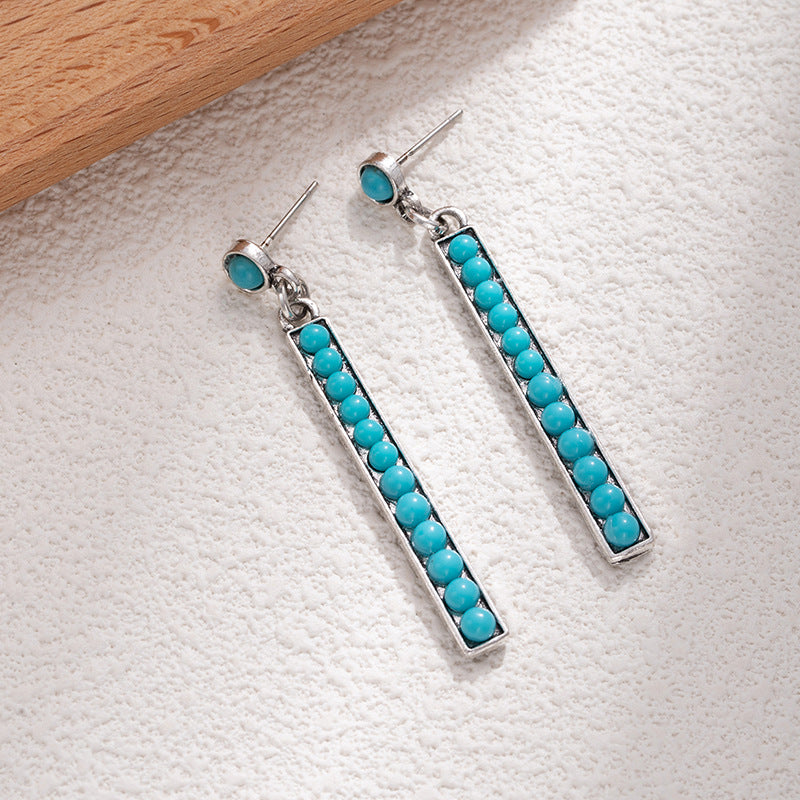 Wholesale Retro long exaggerated earrings for women alloy inlaid with white turquoise long earrings